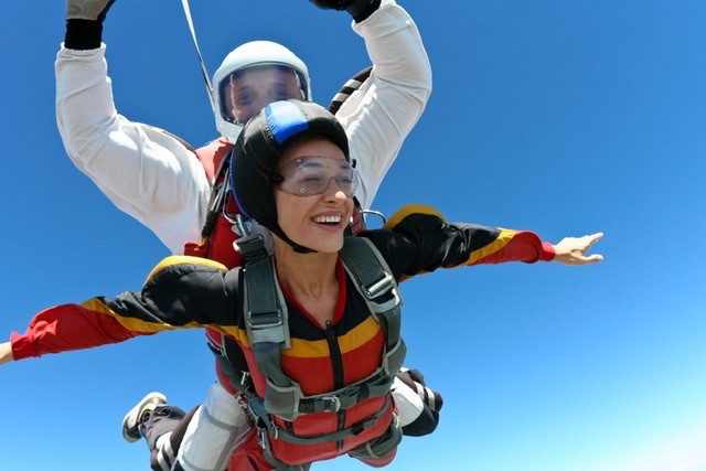 Create meme: anna radchenko is a parachutist, parachute jump, parachute jump in tandem