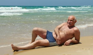Create meme: an elderly man on the beach, grandfather on the beach, grandfather is lying on the beach