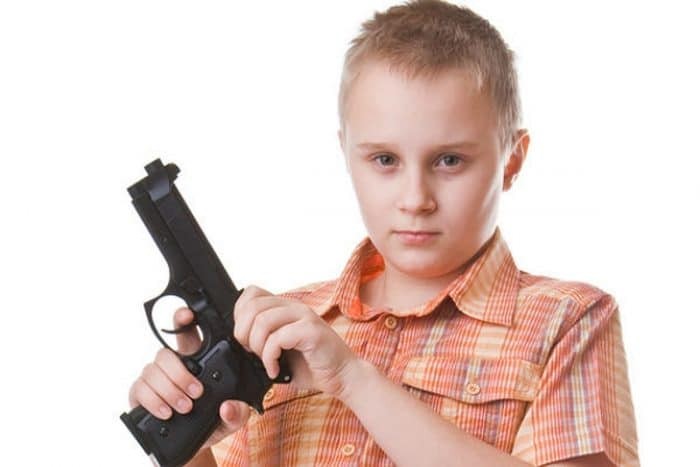 Create meme: the boy with the gun, pistols for children, student 