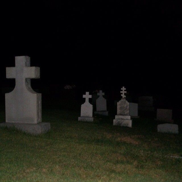 Create meme: russian cemetery at night, a ghost in the cemetery, beautiful cemetery