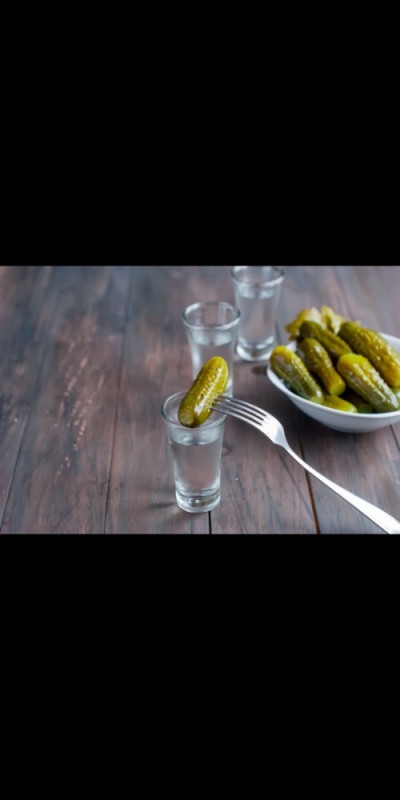 Create meme: vodka with cucumber, glass with cucumber, pickles