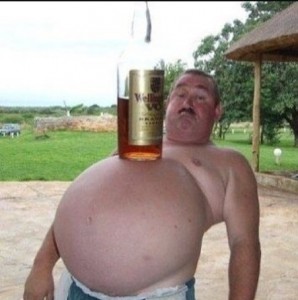 Create meme: funny pictures about fat men, a bottle of beer on the belly, fat guy photo funny