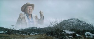 Create meme: cowboy screams in the mountains clip, a man in a hat yelling in the mountains, screaming old cowboy