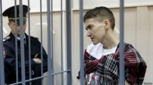 Create meme: Nadezhda Savchenko in jail, Savchenko in a cage, hope Savchenko in court