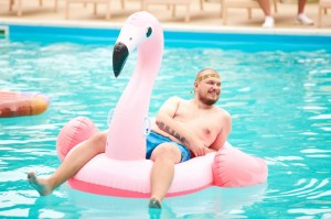 Create meme: pool party, flamingo, man in pool