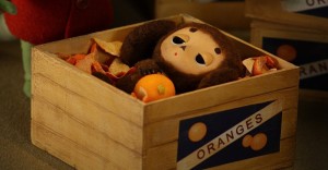 Create meme: Cheburashka in the box of oranges