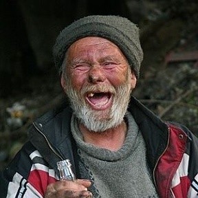 Create meme: photo of homeless man with no teeth, the bum laughs, homeless ava