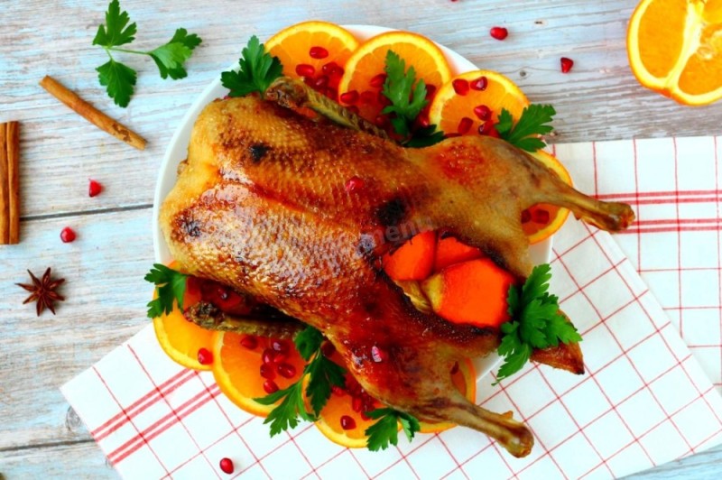 Create meme: duck in orange sauce, seasoning duck with oranges, duck with oranges in the oven