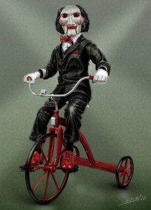 Create meme: saw doll on the bike, Billy doll on the bike, the doll from saw on the bike