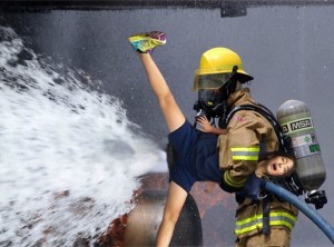 Создать мем: пожарные тушат пожар, firefighter, fire fighter