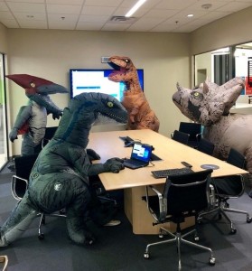 Создать мем: надувной динозавр большой, t-rex костюм, офис смешно