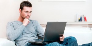 Create meme: a man sits with a smile, sad the man behind the computer, the man behind the notebook pictures