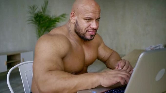 Create meme: bald Jock, a bald wrestler with a laptop, Jock with a laptop