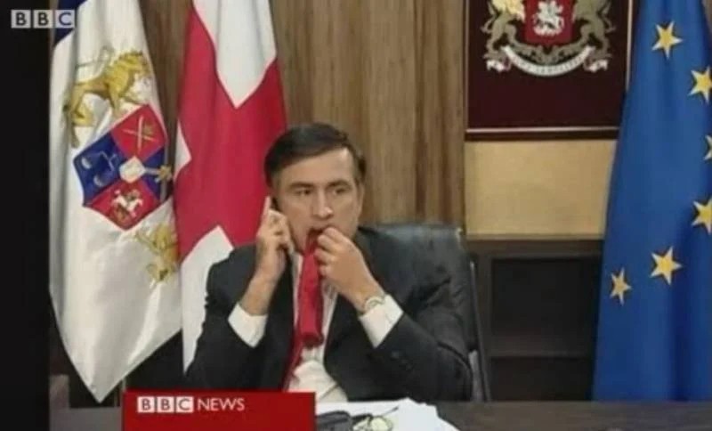 Create meme: Mikheil Saakashvili , the incident with Saakashvili's tie, Saakashvili chewing his tie