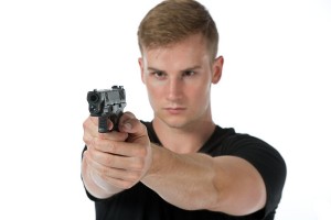 Создать мем: молодой человек с пистолетом, quest pistols, парень