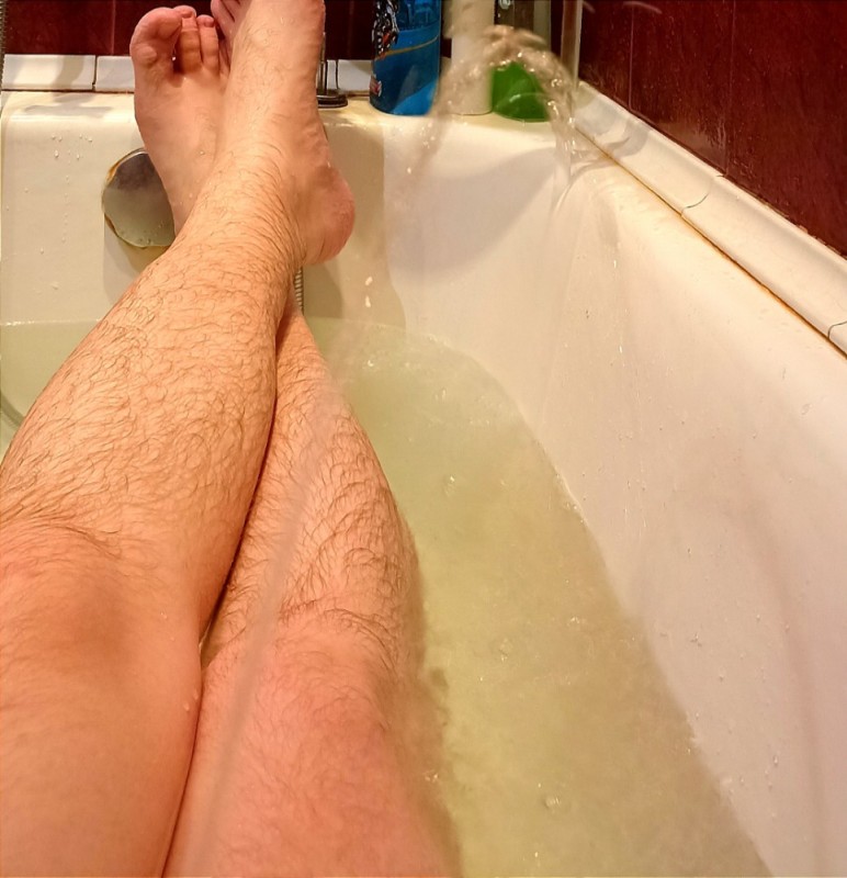 Create meme: men's feet in the bathroom, guys' legs, people 