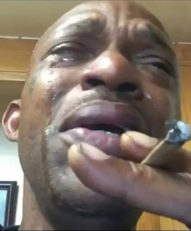 Create meme: ebony crying, crying black man with a cigarette, meme crying nigger