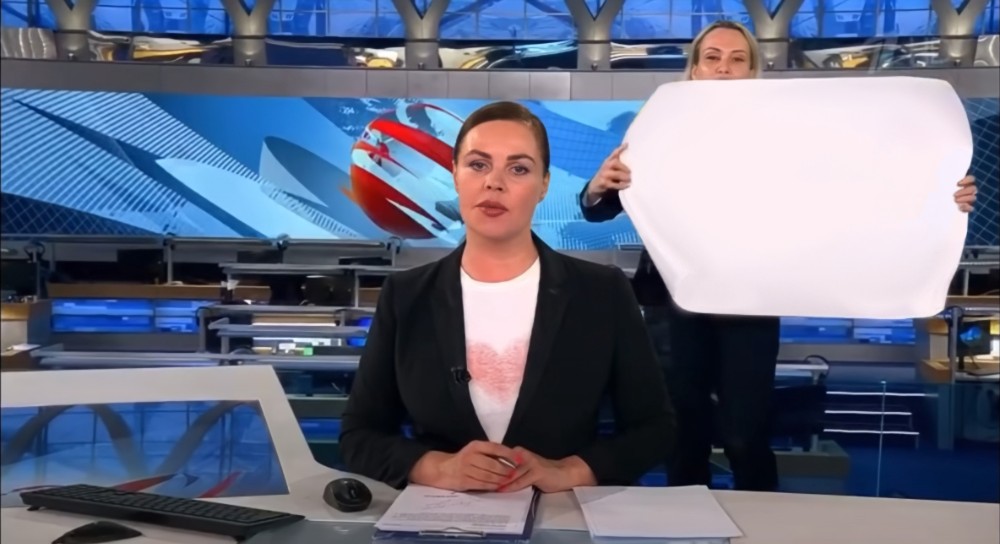 Create meme: live broadcast, Ovsyannikova and Ekaterina Andreeva on the air of Channel one, a poster on the air of the first channel