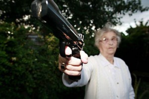 Создать мем: бабушка стреляет, бабушка с пистолетом, бабка с пистолетом