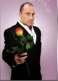 Create meme: Dmitriy Nagiev , nagiyev with flowers, man with flowers