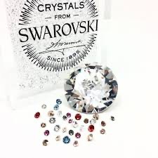 Создать мем: серьги с кристаллами, swarovski crystals, swarovski логотип