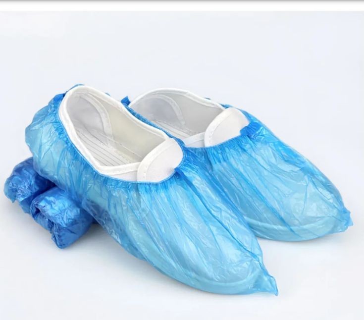 Create meme: shoe covers standard 100 pcs per pack., shoe covers /extra blue, 100 pcs., disposable blue shoe covers
