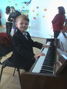 Create meme: boy, playing the piano, children's music school