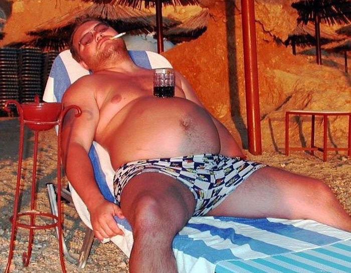 Create meme: fat men on the beach, pot-bellied man at sea, The man is resting