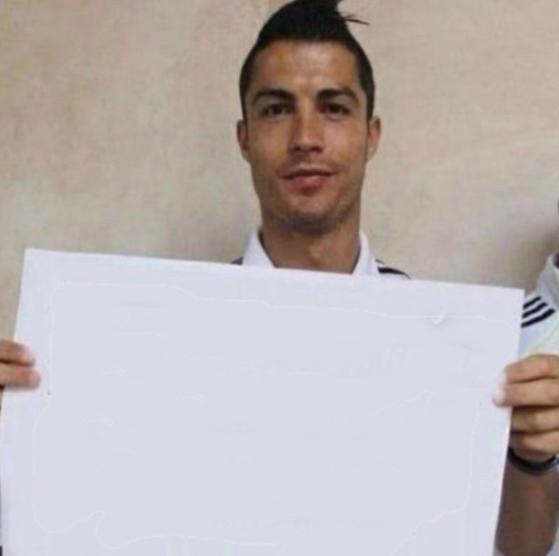 Create meme: Cristiano Ronaldo holds a piece of paper, ronaldo with a leaf, Cristiano Ronaldo 