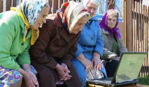 Create meme: pensioners in Russia, grandmother on the bench in the village, grandmother with laptop