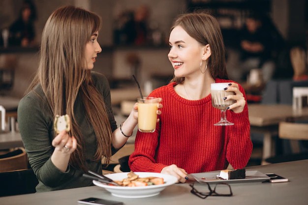 Create meme: Two girls in a cafe, friend in the cafe, two friends in a restaurant