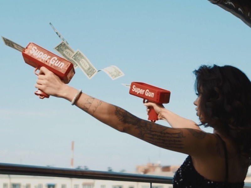 Create meme: A gun for money, The girl throws money around, The money gun