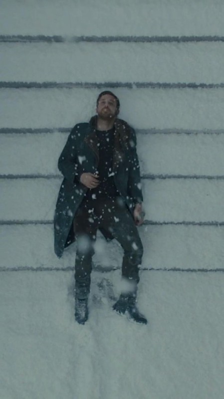 Create meme: Ryan Gosling , blade runner, Ryan Gosling Blade Runner 2049 lies in the snow