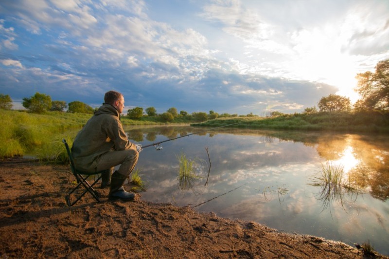 Create meme: fishing , a fisherman on the riverbank, feeder fishing