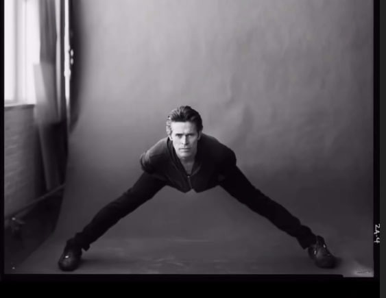 Create meme: man photo shoot, guy , Willem Dafoe is sitting on the splits