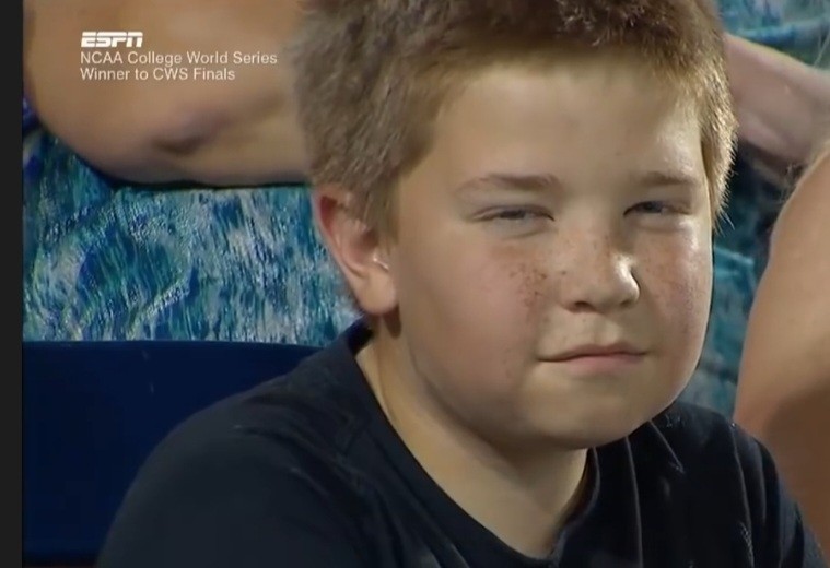 Создать мем: мем рыжий пацан на стадионе, мальчик строит глазки, boy's epic staredown battle goes viral