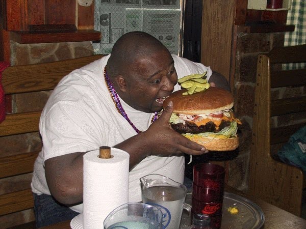 Create meme: feeling hungry and feeling full, a negro eats a burger, moscow photos