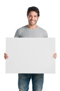 Create meme: a man holds a poster