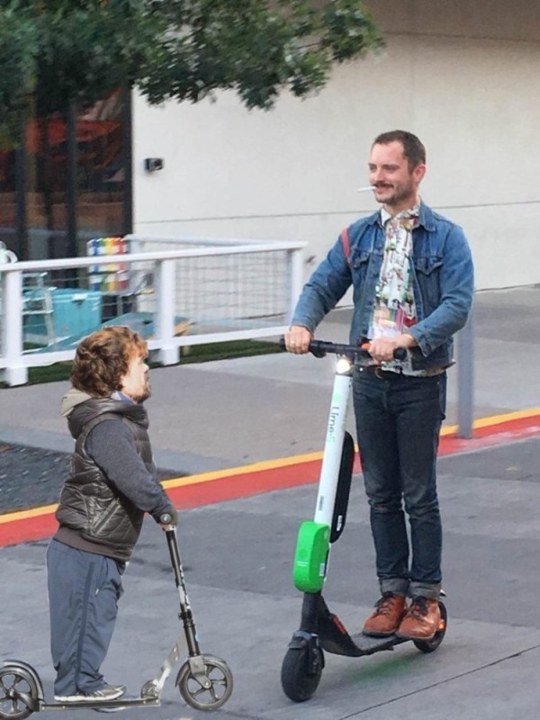 Create meme: Elijah Wood on a scooter, an electric skateboard, scooter