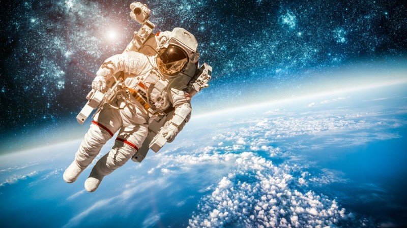 Create meme: astronaut in space, on the day of cosmonautics , man in space 
