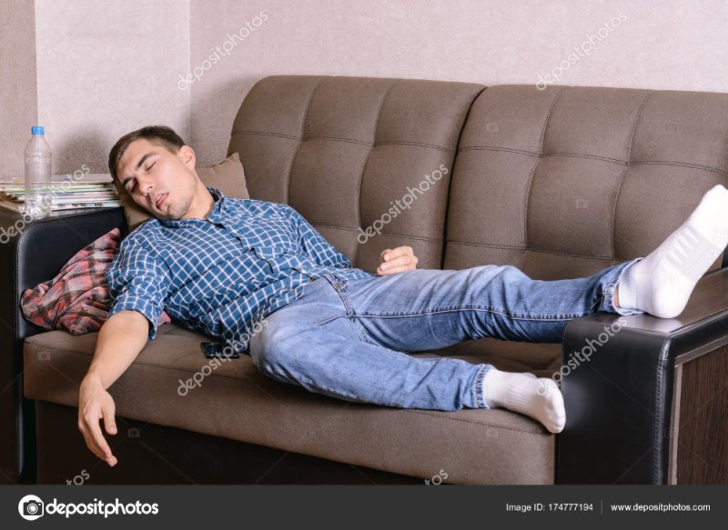 Create meme: the man on the couch, man lying on the sofa, a man is lying on the couch 