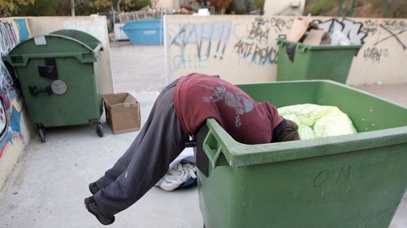 Create meme: a homeless man climbs in the trash, trash , dumpster 