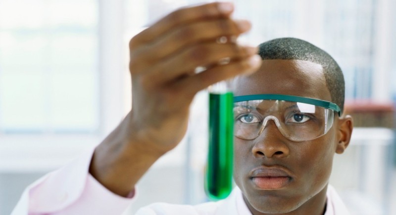 Create meme: the negro is a smart meme, scientist with a test tube, the negro scientist