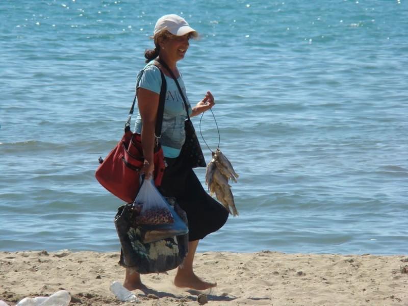 Create meme: merchant on the beach, the seller on the beach, tourists in crimea