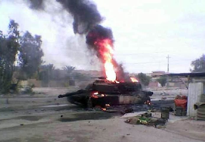 Создать мем: горящий танк, сгоревший сирийский танк, взорванный танк