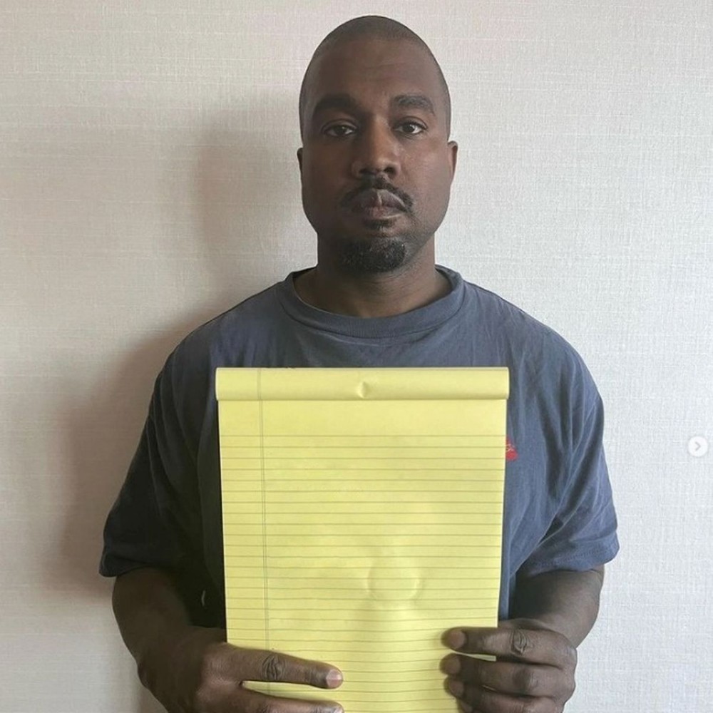 Create meme: Kanye West with a piece of paper, Kanye West with a yellow piece of paper, kanye kanye