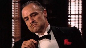Create meme: johnny Fontane godfather, the godfather film photo, don Corleone Smoking a cigar