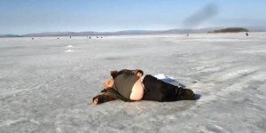 Create meme: the drunk fisherman in the winter, fisherman fell asleep on the ice, bat bite