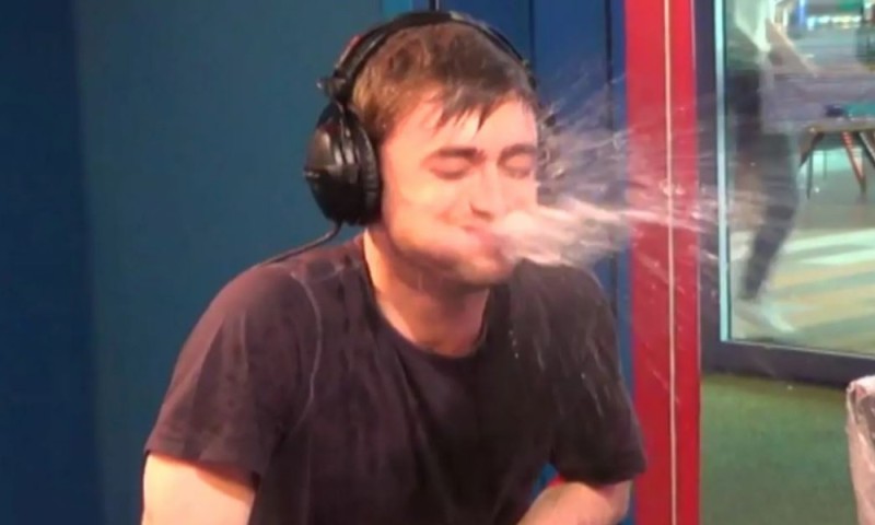 Create meme: Daniel Radcliffe spits water, Daniel Radcliffe laughs with water, radcliffe spits water