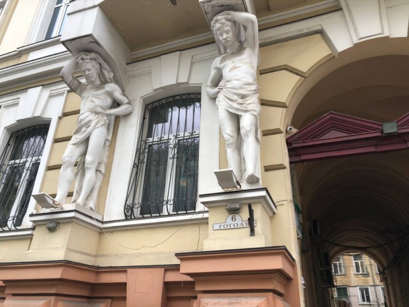 Create meme: figure, the house with Atlantes, atlanteans in St. petersburg